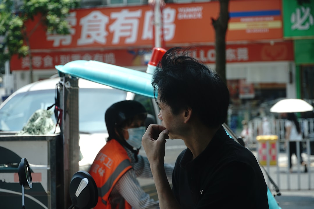 Person in a modern, minimalist setting holds a smartphone in one hand and a VR headset in the other, symbolizing the strat...